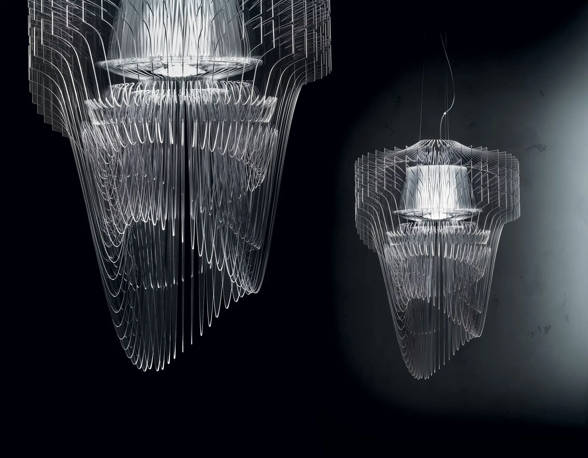 Modern wireframe chandeliers against dark background