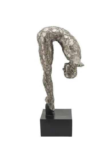Metallic abstract figure sculpture on black base