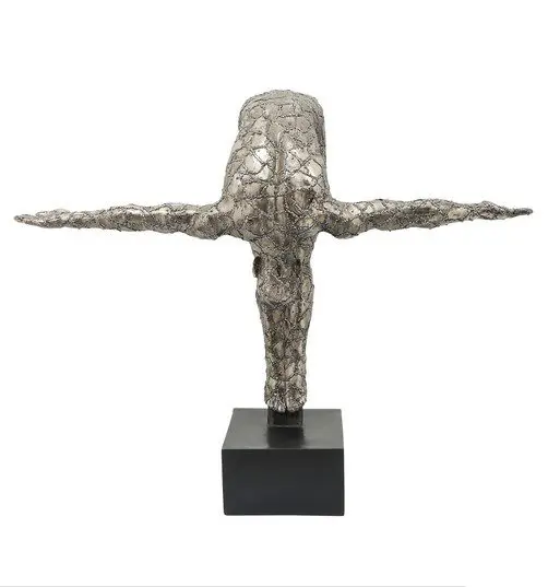 Metallic abstract sculpture with outstretched arms