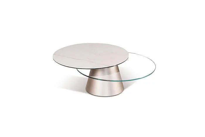 Stylish round table featuring glass and metal.
