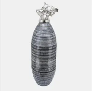 Artistic vase featuring textured metal design