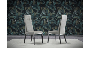 Elegant chairs with tropical wallpaper backdrop